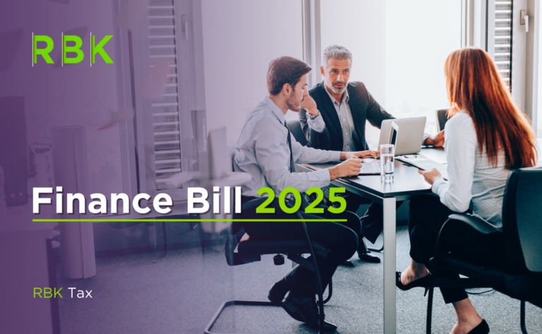Three business professionals sit at a table in a modern office, discussing documents and using laptops. Overlay text reads “Finance Bill 2025” and “RBK Tax” with the RBK logo on the left.