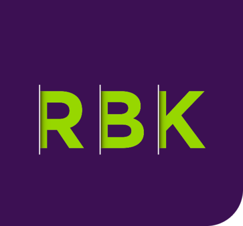 The image features the letters RBK in bold, bright green text, each separated by a white vertical line, set against a dark purple background with rounded corners.