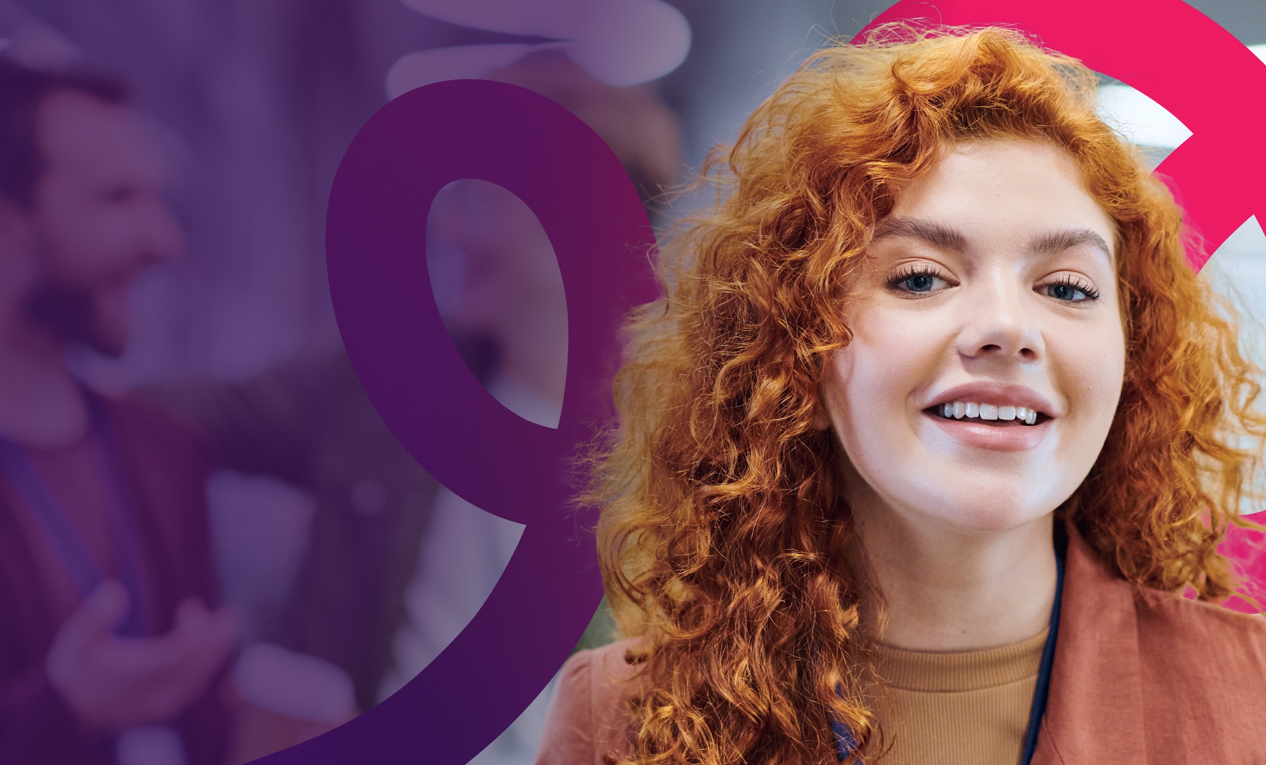 A young woman with curly red hair smiles at the camera. She wears a brown jacket and light top. The background is blurred, showing people and abstract purple and pink graphic shapes overlaying the image.